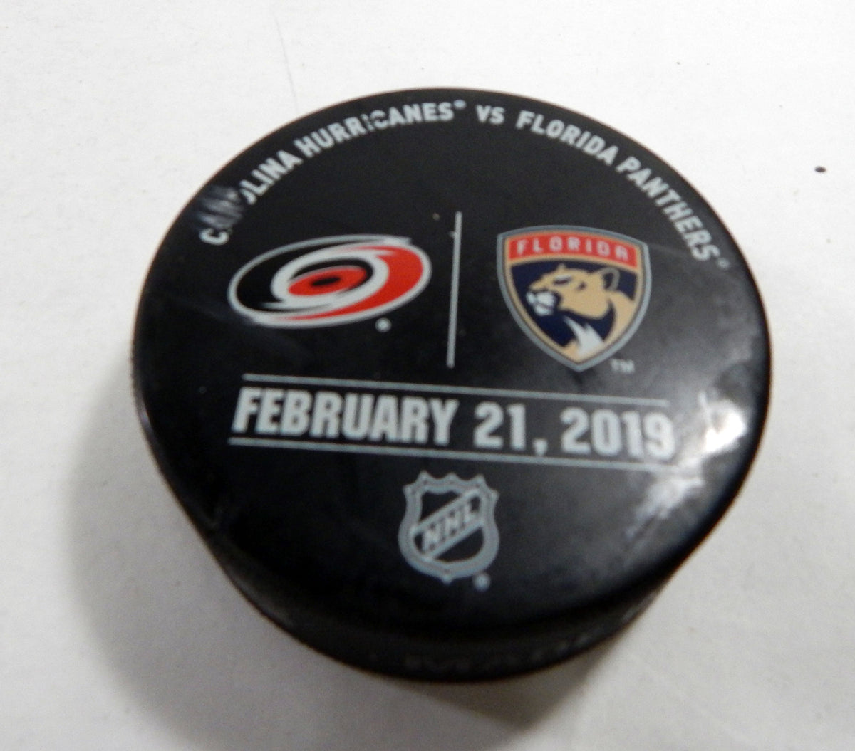 Florida Panthers Vs. Carolina Hurricanes Game Used Black Warm Up Puck DP61344