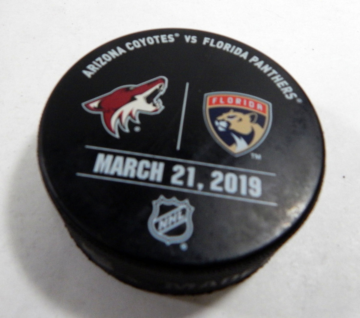 Florida Panthers Vs Arizona Coyotes Game Used Black Warm Up Puck DP61354