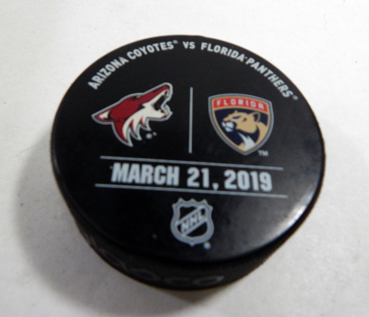 Florida Panthers Vs Arizona Coyotes Game Used Black Warm Up Puck DP61359
