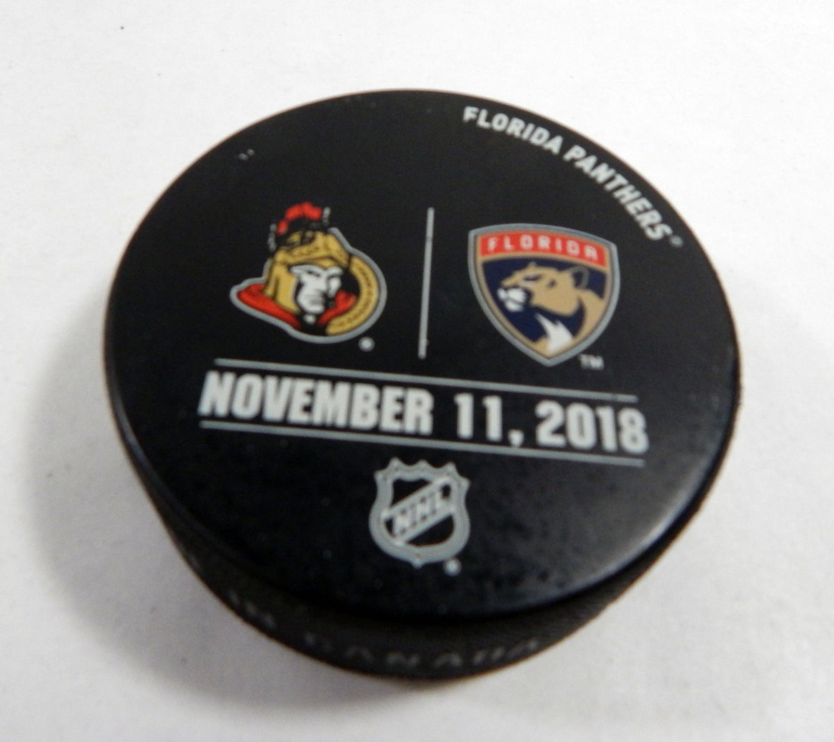 Florida Panthers Vs. Ottowa Senators Game Used Black Warm Up Puck DP61368