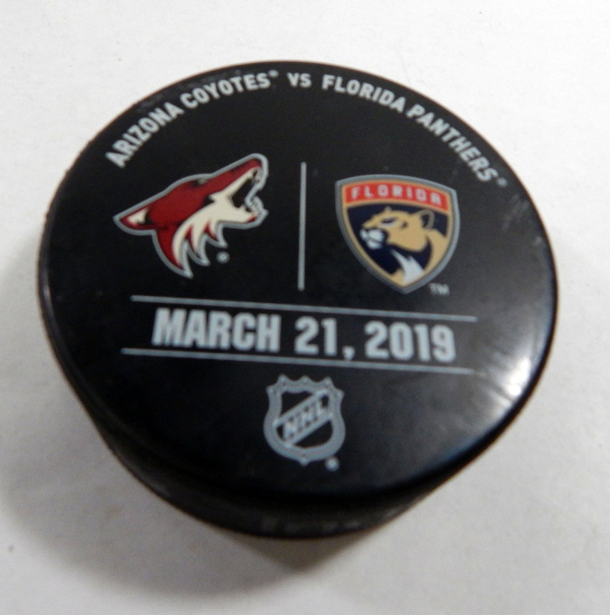 Florida Panthers Vs Arizona Coyotes Game Used Black Warm Up Puck DP61373