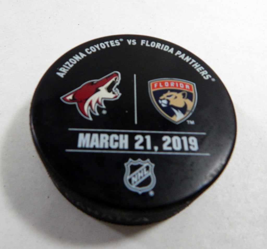 Florida Panthers Vs Arizona Coyotes # Game Used Black Warm Up Puck DP61385