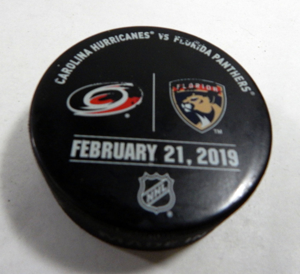 Florida Panthers Vs. Carolina Hurricanes Game Used Black Warm Up Puck DP61387