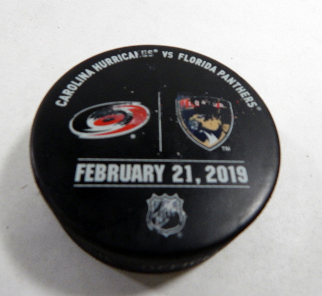 Florida Panthers Vs. Carolina HurricanesGame Used Black Warm Up Puck DP61388