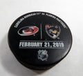 Florida Panthers Vs. Carolina HurricanesGame Used Black Warm Up Puck DP61388
