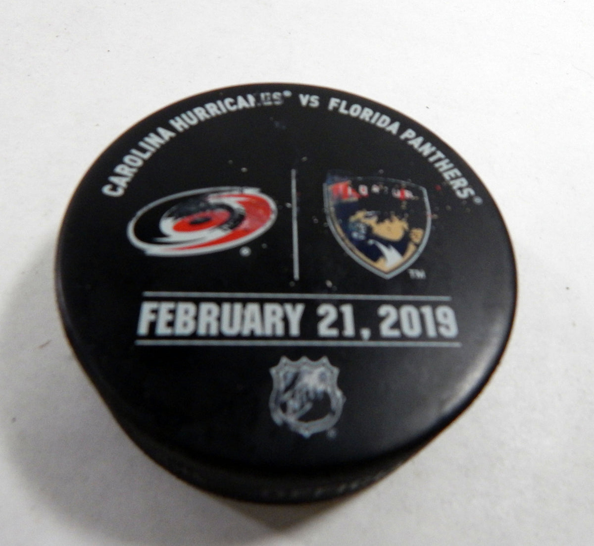 Florida Panthers Vs. Carolina HurricanesGame Used Black Warm Up Puck DP61388