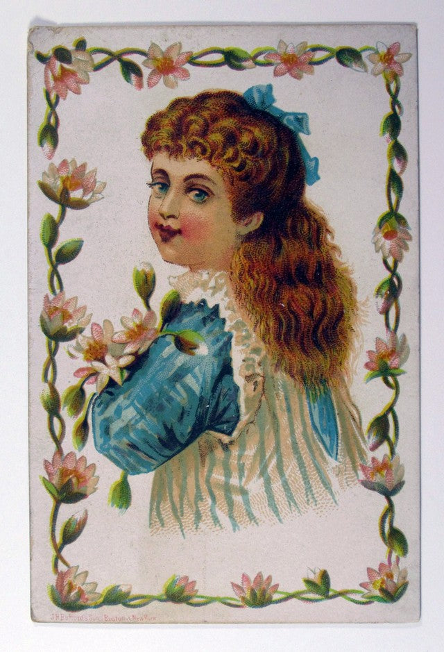Photo Girl with red hair posing with white flowers in hand Vintage Trade Ad Card